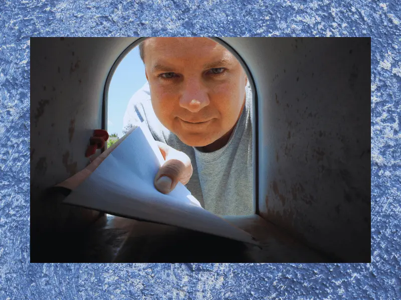 image of a man removing mail from a mailbox