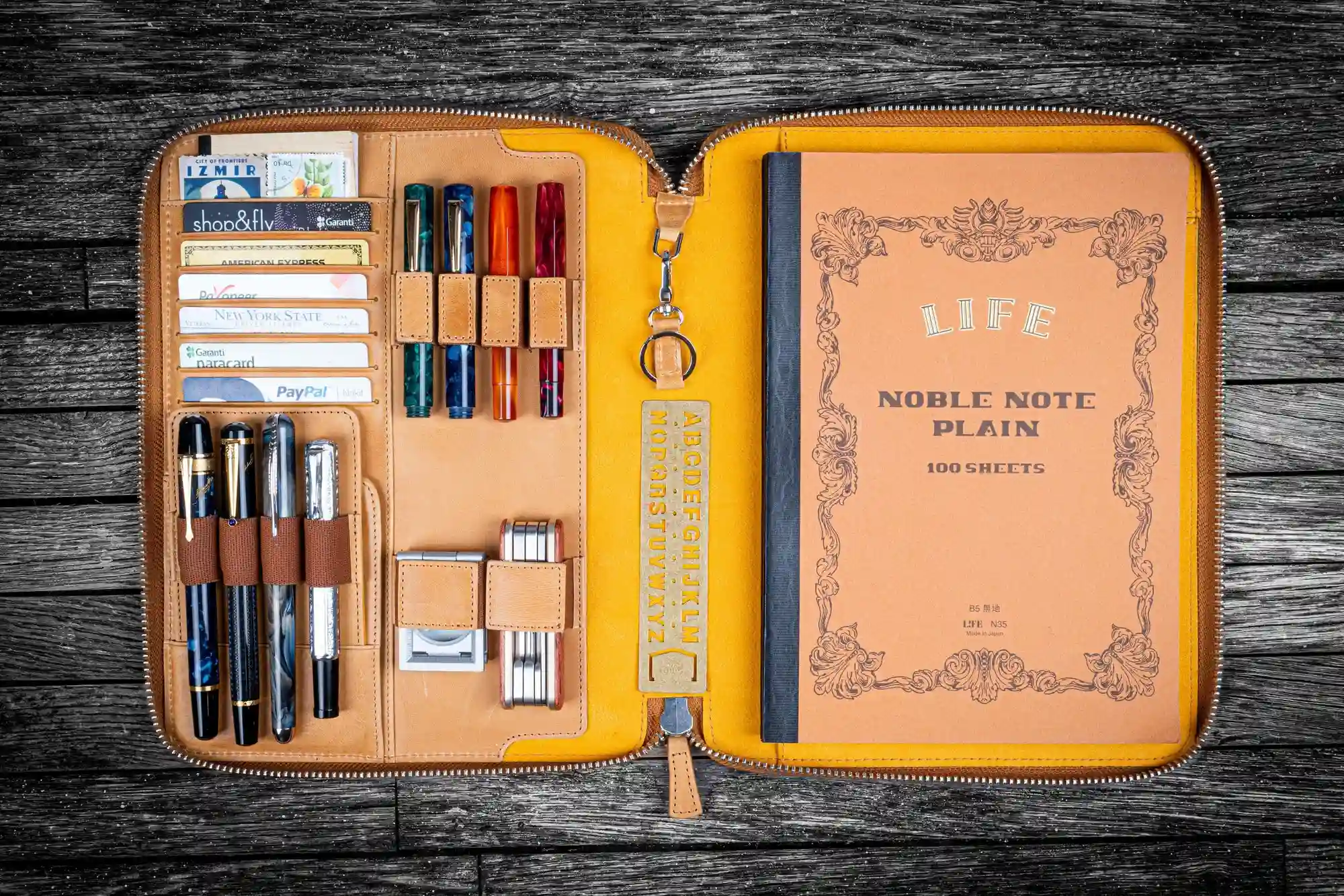 Gift Ideas For Him: Leather folio with pens and notebook beautifully arranged